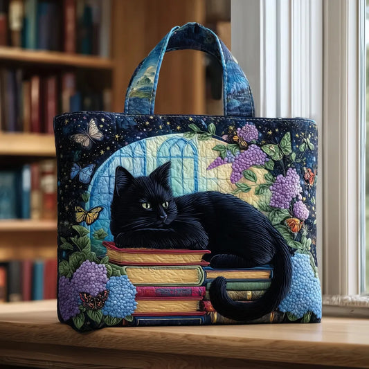 Bolso artesanal gato negro sobre los libros
